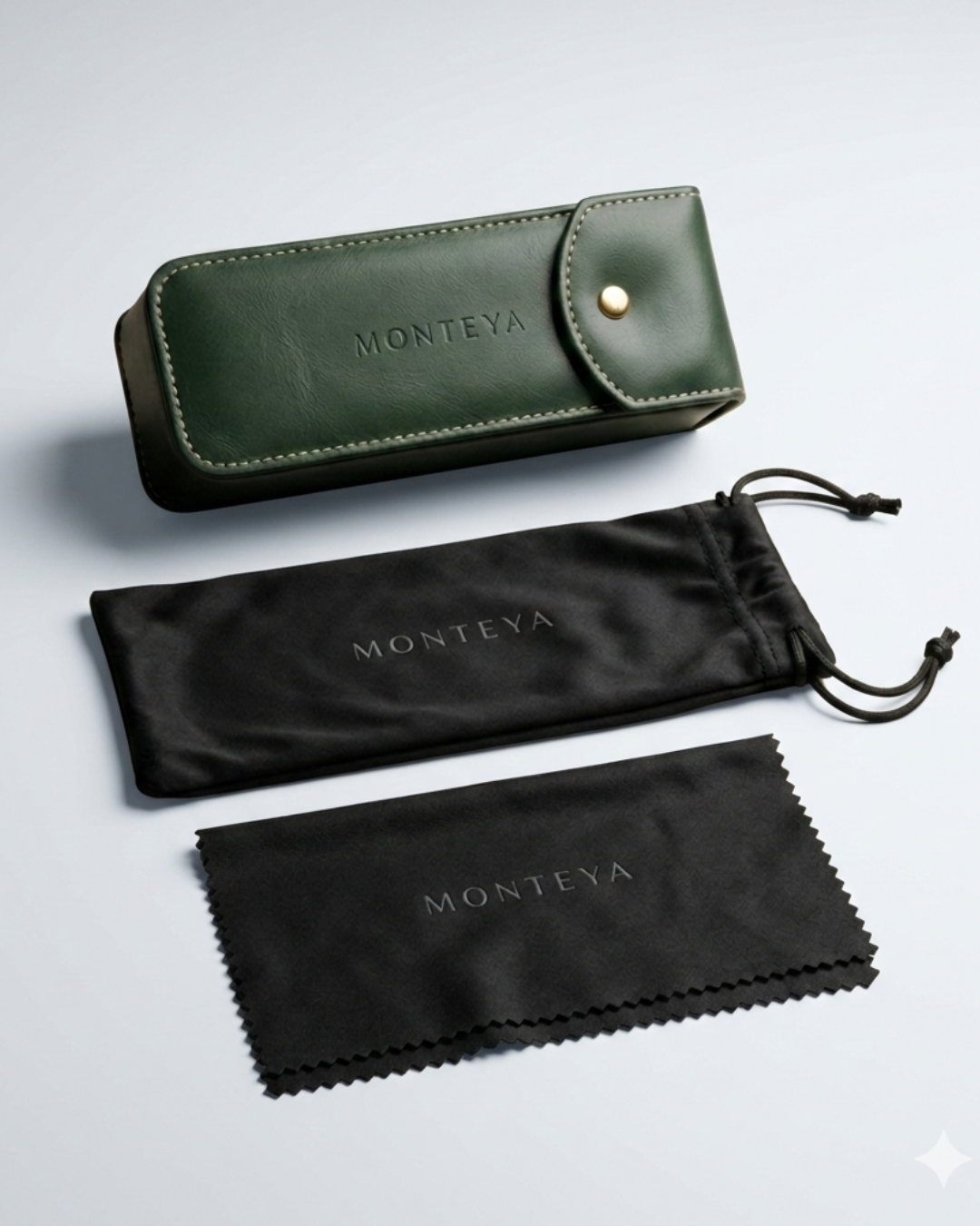 Monteva eyewear accessories including a green leather case and black pouches on a light gray background